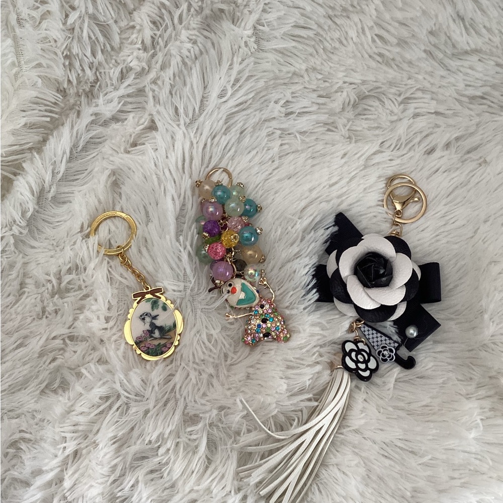 Two purse charms and  keychain